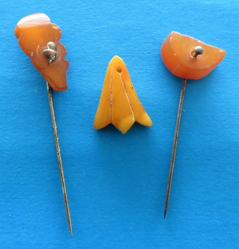 German Donation Trio - Amber - morpeth antique centre hunter valleywildflower german third reich winter charity relief badge amber baltic tinnie donation pin token plastic glass timber pottery metal